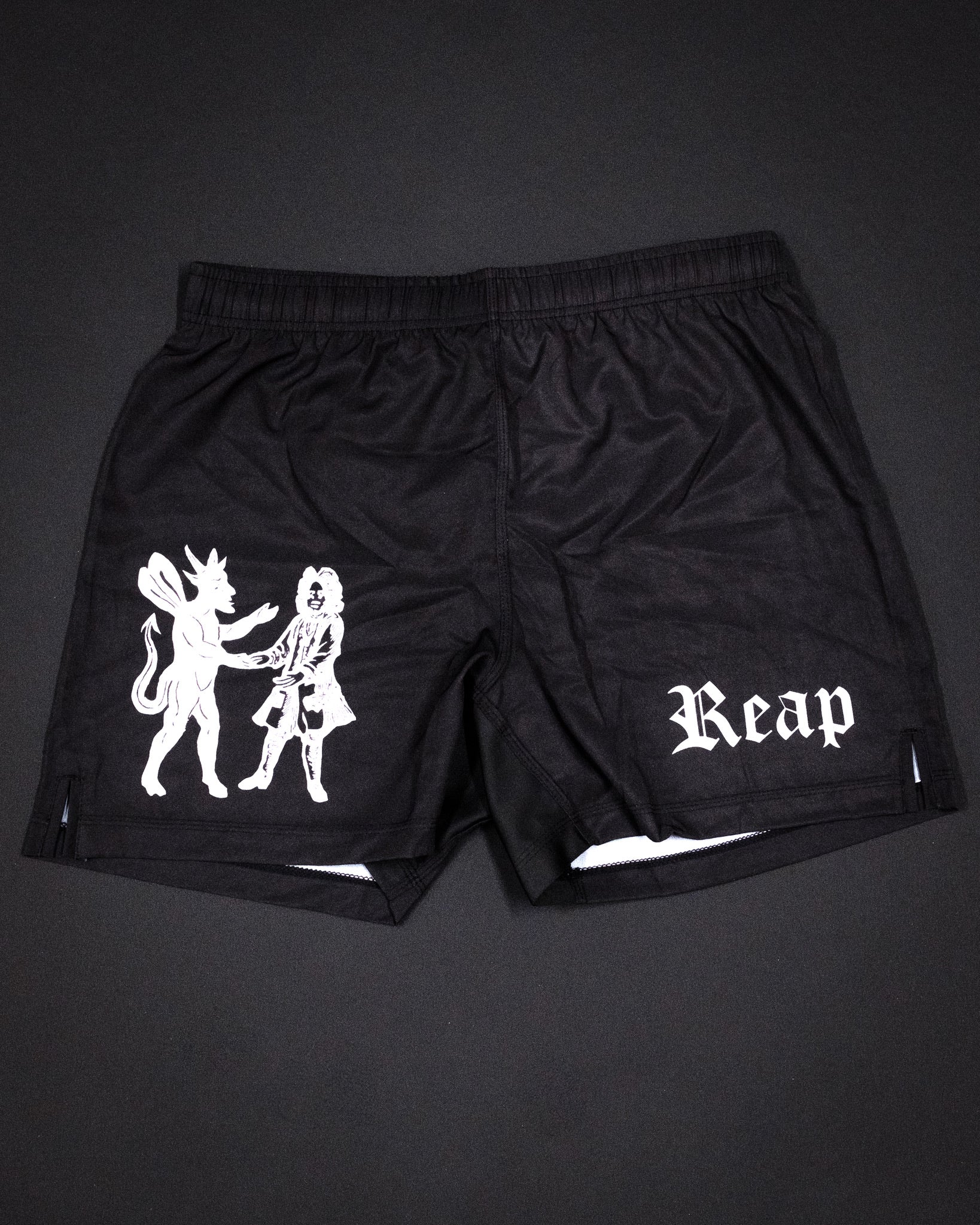 Meeting with the Devil Jiu Jitsu shorts by Reap Jiu Jitsu, premium grappling shorts for martial arts, BJJ, and combat sports training. Bold, unique design combining performance, durability, and style for Jiu Jitsu enthusiasts.