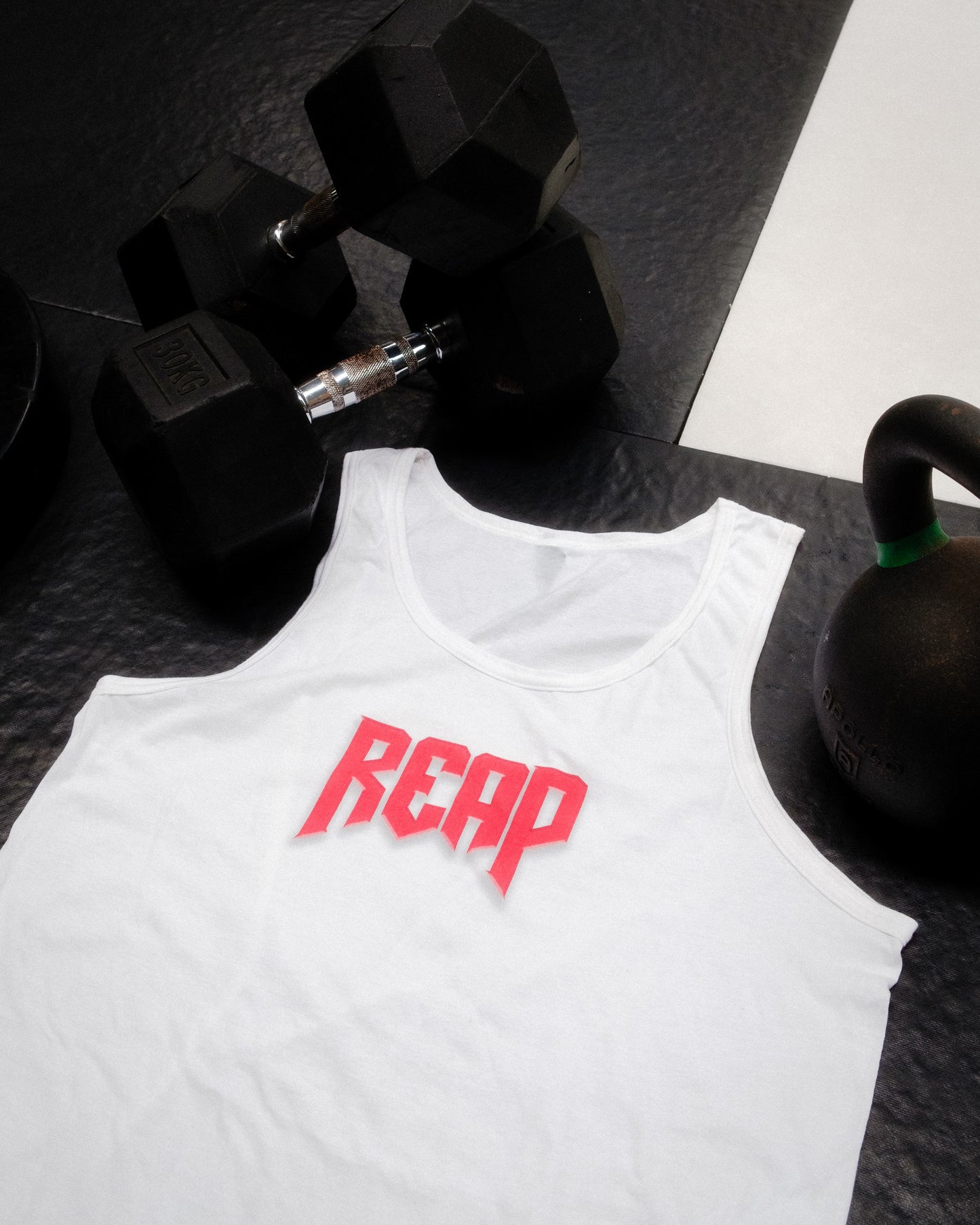 White Jiu Jitsu workout vest from Reap Jiu Jitsu, featuring a sleek design for active individuals. Ideal for martial arts training and fitness activities.