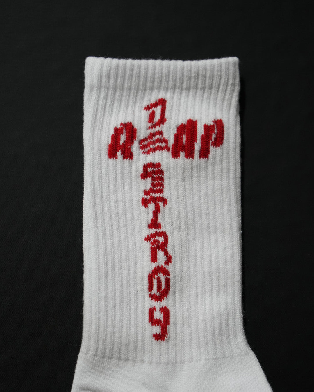 Reap and Destroy white BJJ socks with red print, flat lay view 3