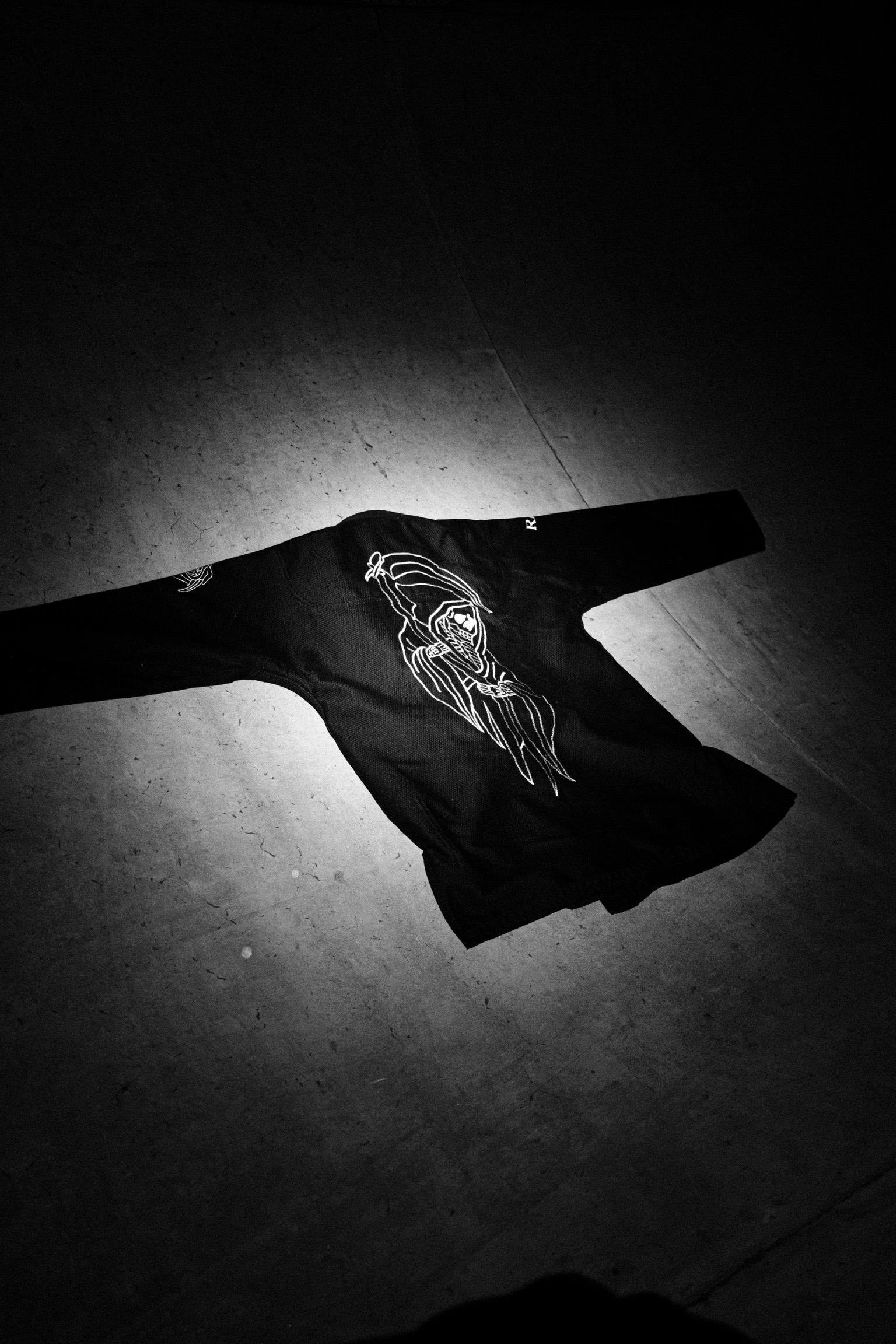 Black gi top against concrete background