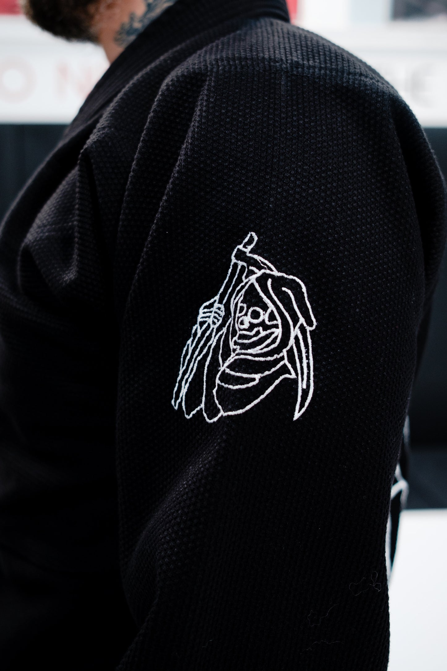 Black Gi with white embroidered design on the side