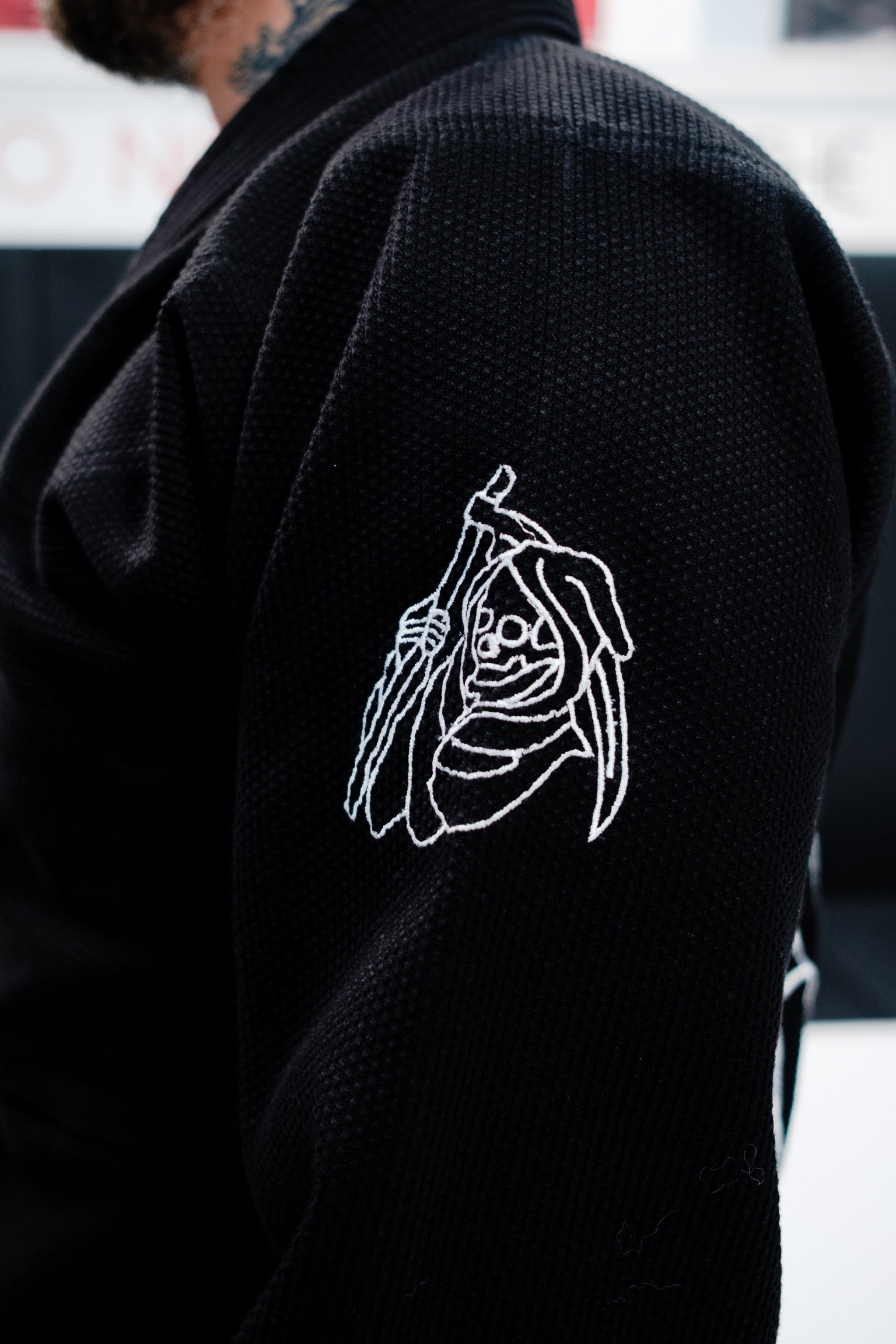 Black Gi with white embroidered design on the side