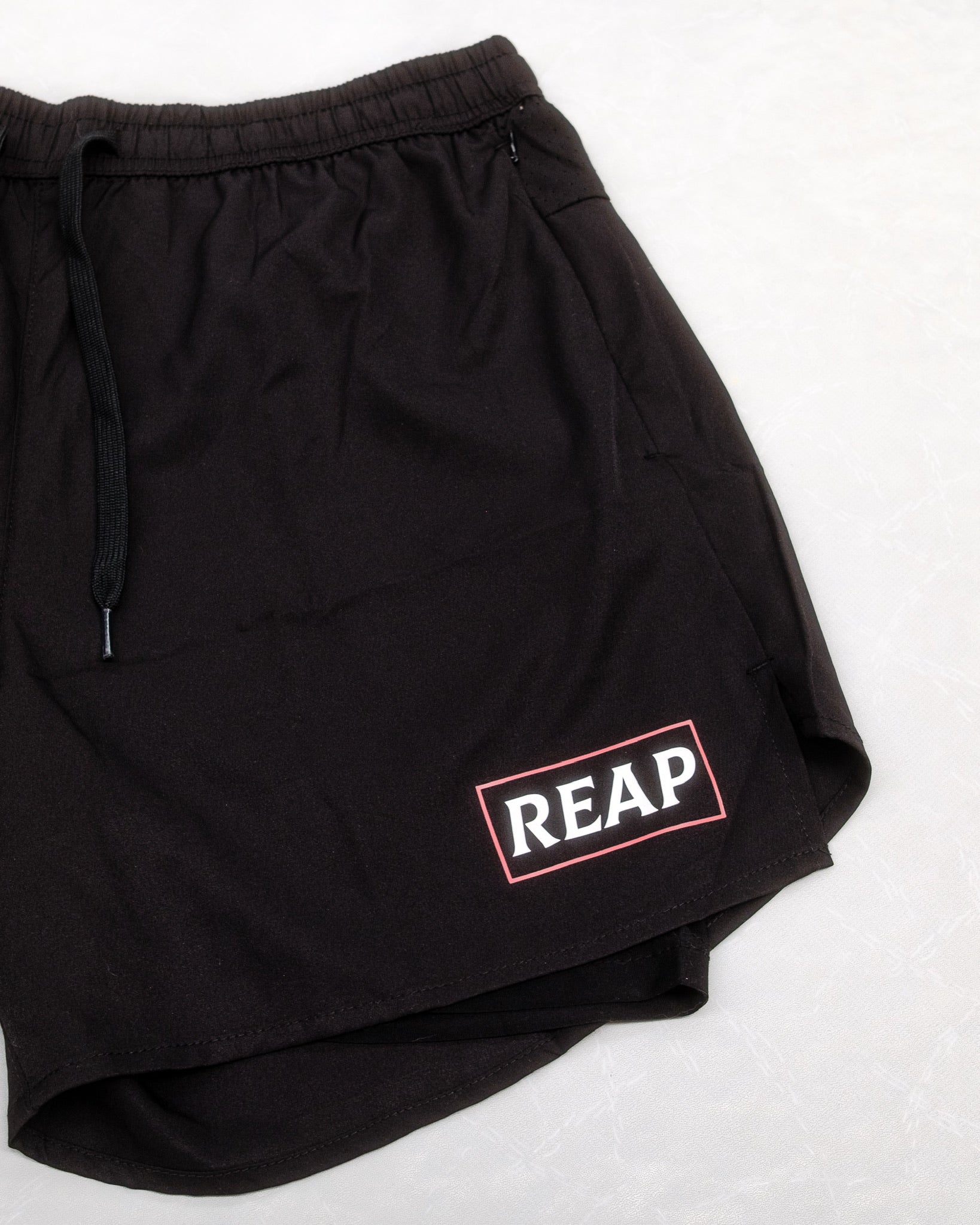 black reap gym shorts with zip pockets