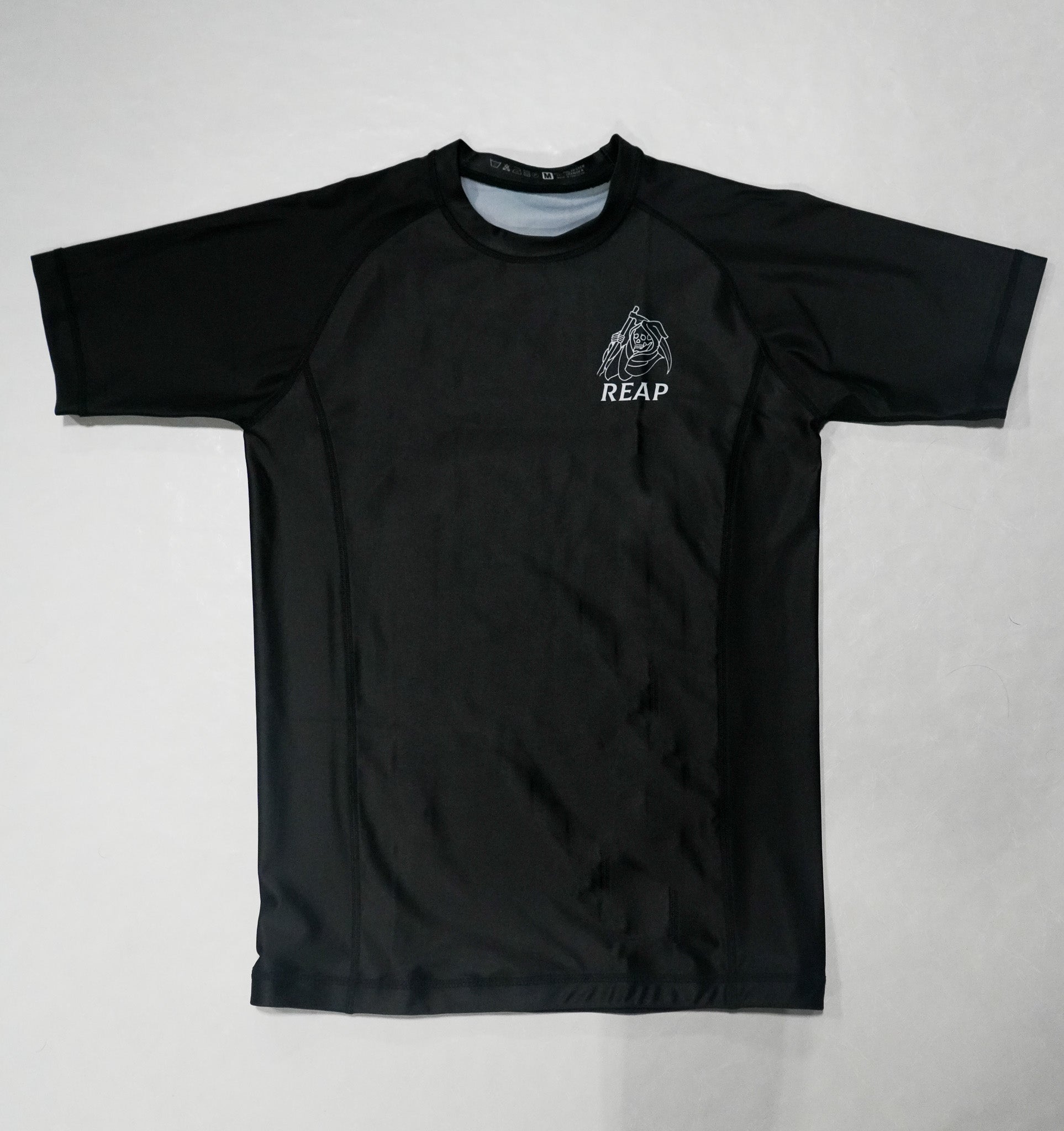 Black t-shirt with a logo on a white background