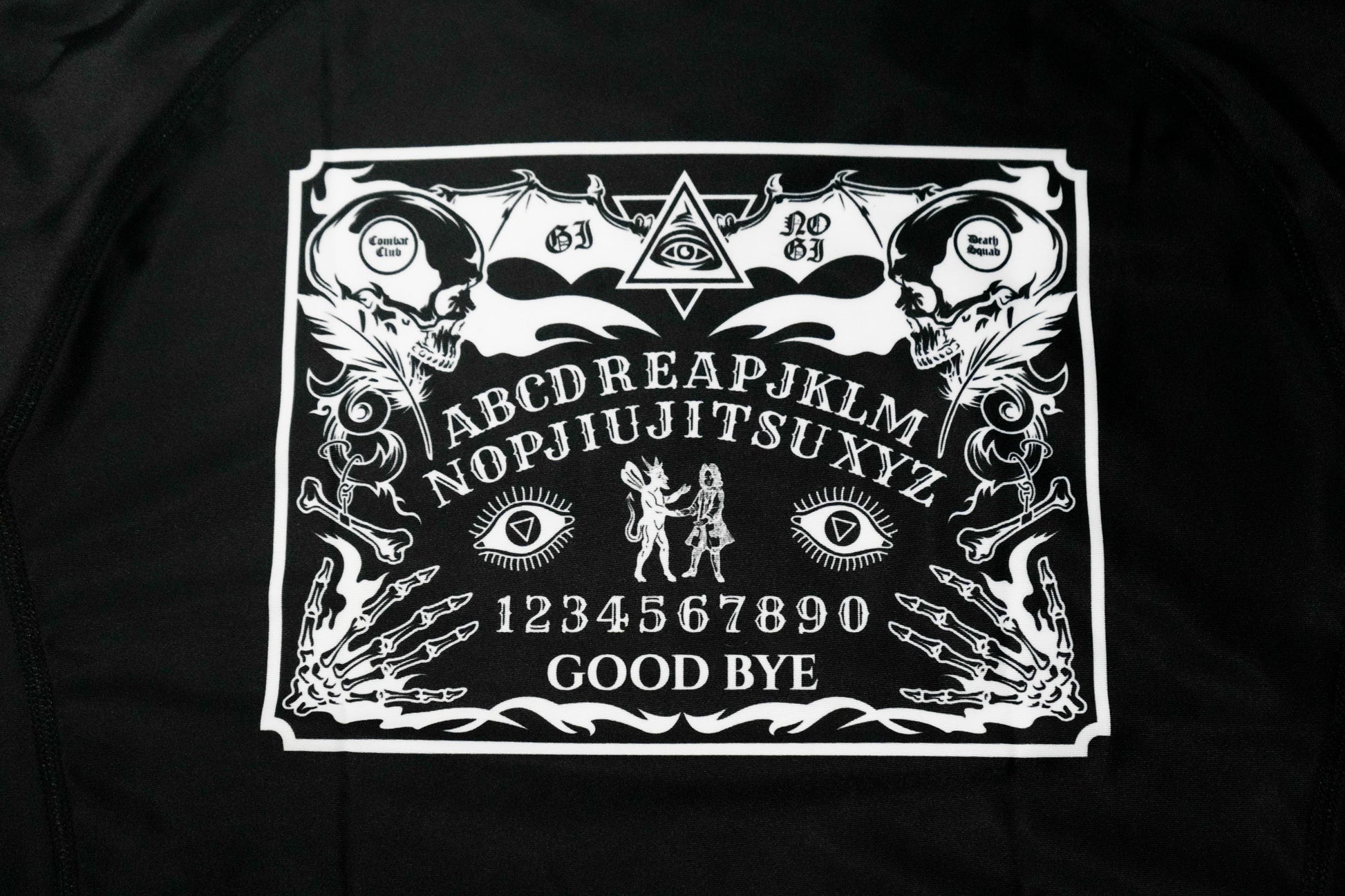 Black t-shirt with white Ouija board design on a black background