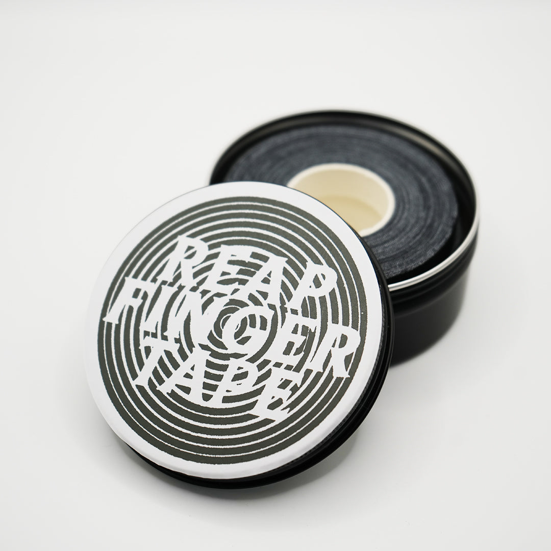 Black Finger Tape in a tin with the lid slightly off and the reap logo on top for Jiu Jitsu
