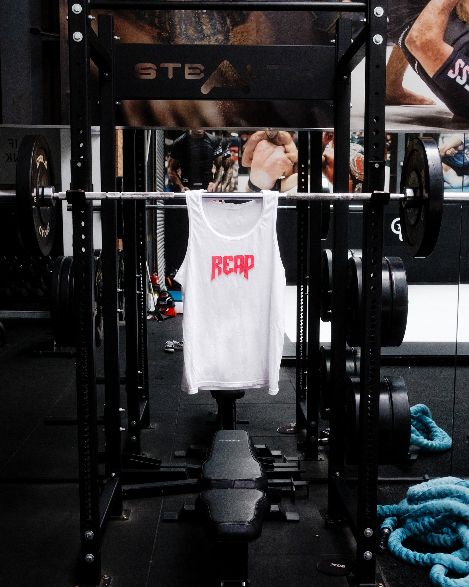 White Jiu Jitsu workout vest from Reap Jiu Jitsu, featuring a sleek design for active individuals. Ideal for martial arts training and fitness activities.