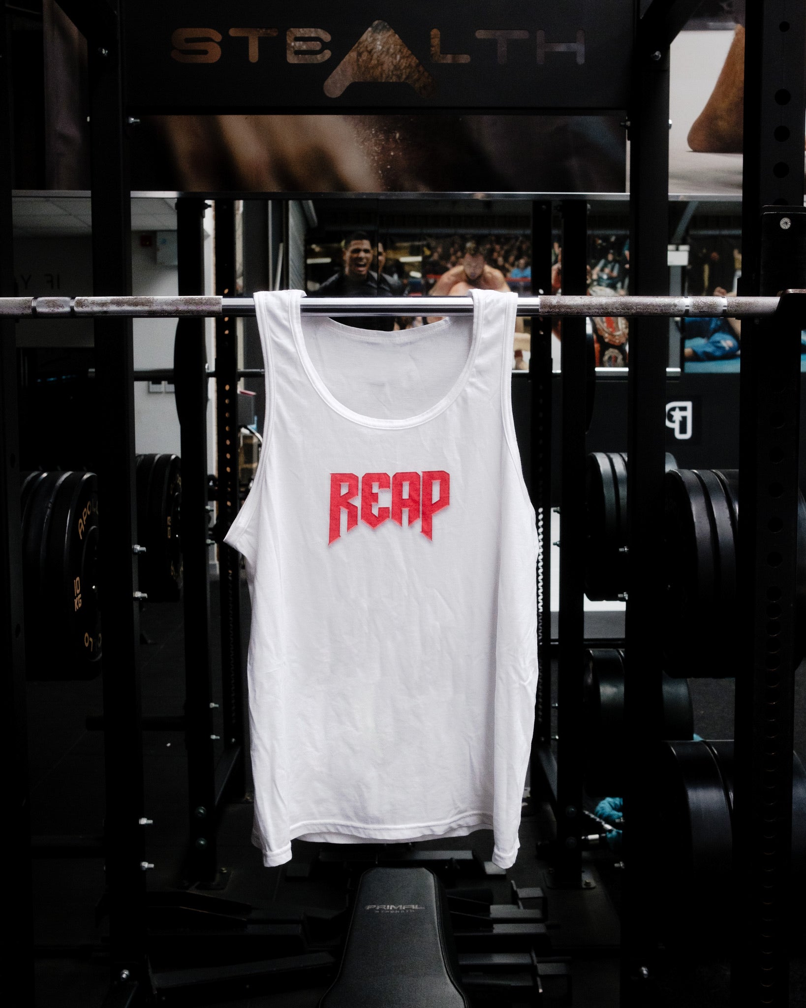 White Jiu Jitsu workout vest from Reap Jiu Jitsu, featuring a sleek design for active individuals. Ideal for martial arts training and fitness activities.